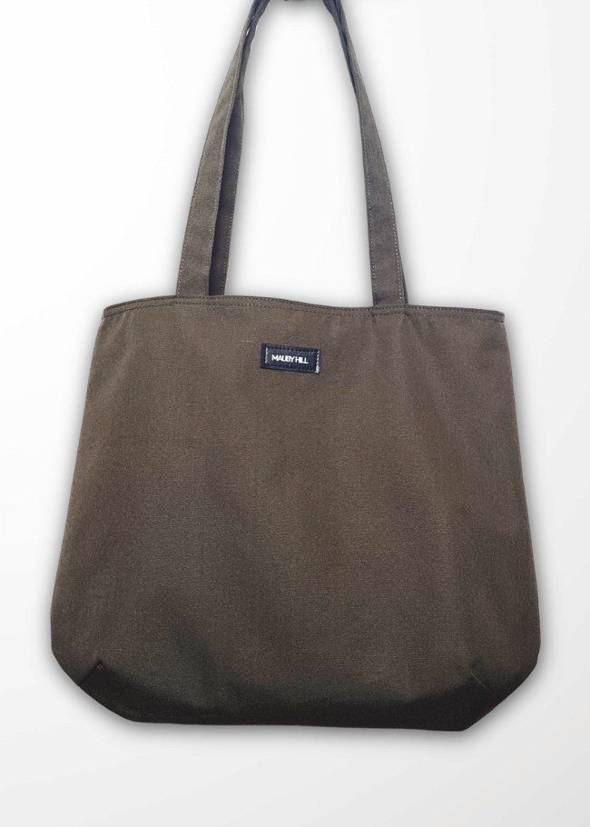 Khaki Green tote bag with a visible brand label on a white background